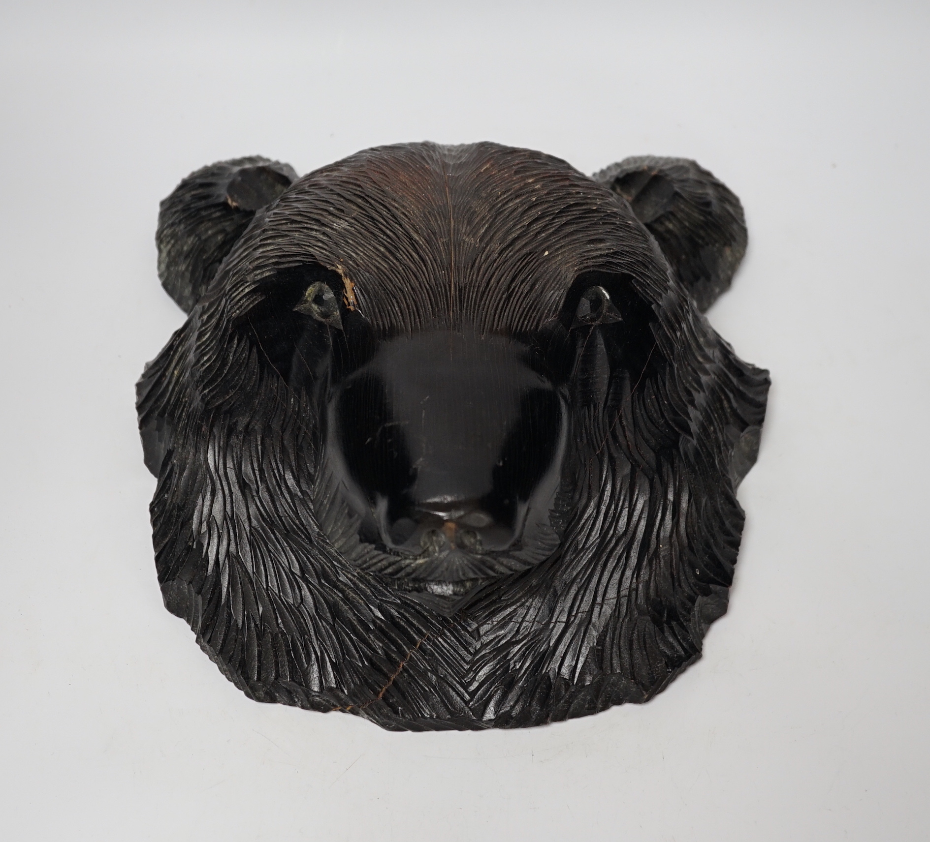 A Japanese carved wall hanging bear's head, 32cm high